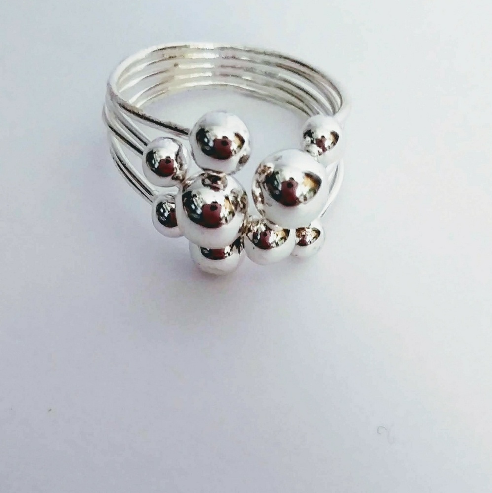 Beautiful adjustable silver tone ring